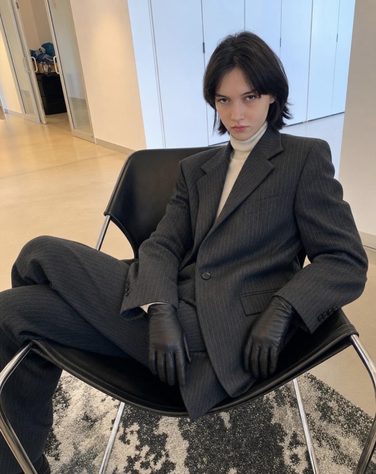 Charcoal pinstripe suit editorial portrait